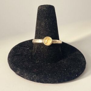 Gold Band Ring with a Yellow Stone